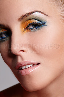 Buy stock photo Close up portrait of a beautiful woman with yellow and green eyeshadow on