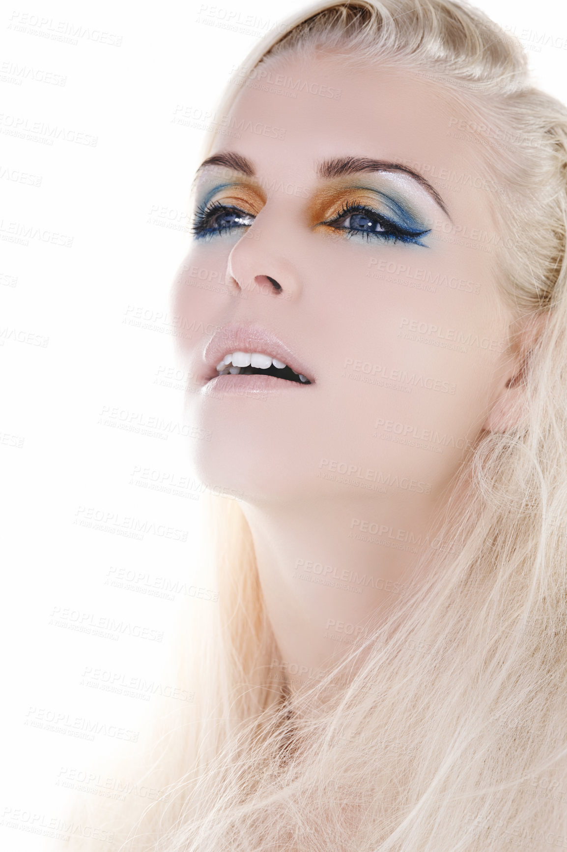 Buy stock photo Woman, rainbow eyeshadow with creative beauty and unique cosmetics for cosmetology in studio. Model face, female person and bold color for festival makeup and glitter sparkle by white background