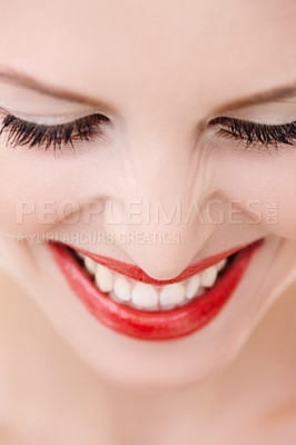 Buy stock photo Cropped closeup shot of a young woman wearing vibrant red lipstick