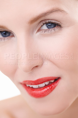 Buy stock photo Cropped closeup shot of a young woman wearing vibrant red lipstick