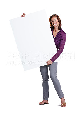 Buy stock photo Portrait, woman and billboard in studio for promotion, advertising and mockup space. Poster, female person and happiness for review, choice and presentation or news by white background with smile