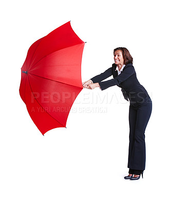 Buy stock photo Full length studio shot of a businesswoman leaning out while holding an umbrella