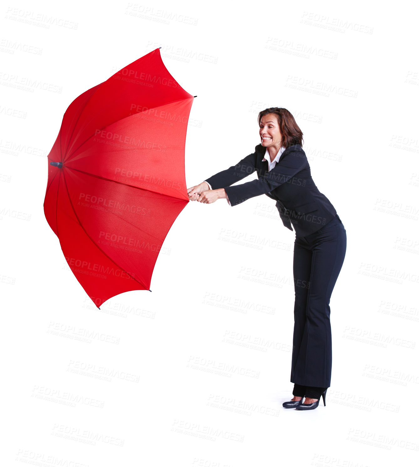 Buy stock photo Full length studio shot of a businesswoman leaning out while holding an umbrella