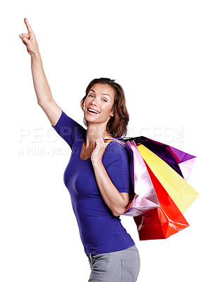 Buy stock photo Happy, woman and customer pointing with shopping bags in portrait for mockup, gift package and deal. Marketing, female person or model for retail choice, sale or promotion with white background