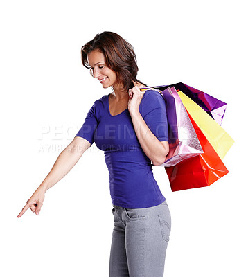 Buy stock photo Happy, woman and hand pointing with shopping bags in portrait for offer, deal and mockup advertising. Marketing, female person or model with retail, sale or discount for promo with white background