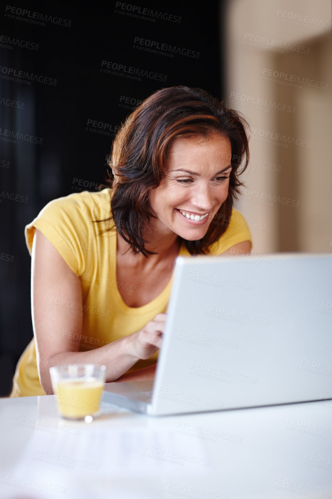 Buy stock photo Woman, typing and laptop in home for remote work, writing email and planning schedule for freelance. Female person, computer and internet research for copywriting career, editing article and smile