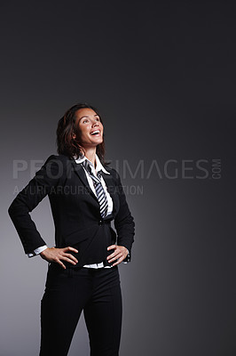 Buy stock photo Smile, corporate and a business woman laughing in studio on a grey background for comedy or humor. Comic, funny and a confident young employee looking happy at a joke as a professional in a suit