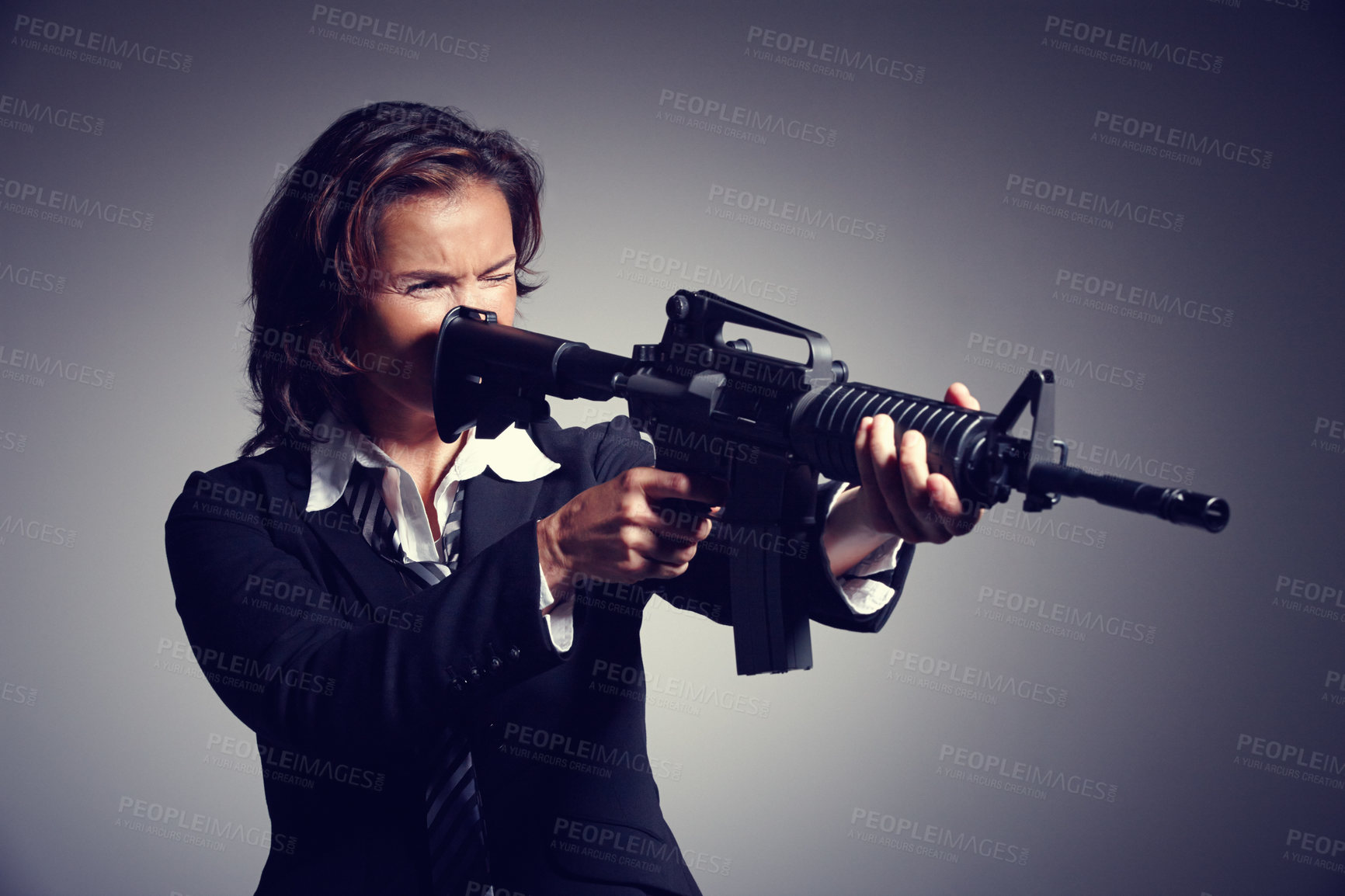 Buy stock photo Gun, weapon and business woman in studio for protection in corporate company, career and job. Professional, boss and isolated person with rifle to fight crime, corruption and mafia on gray background