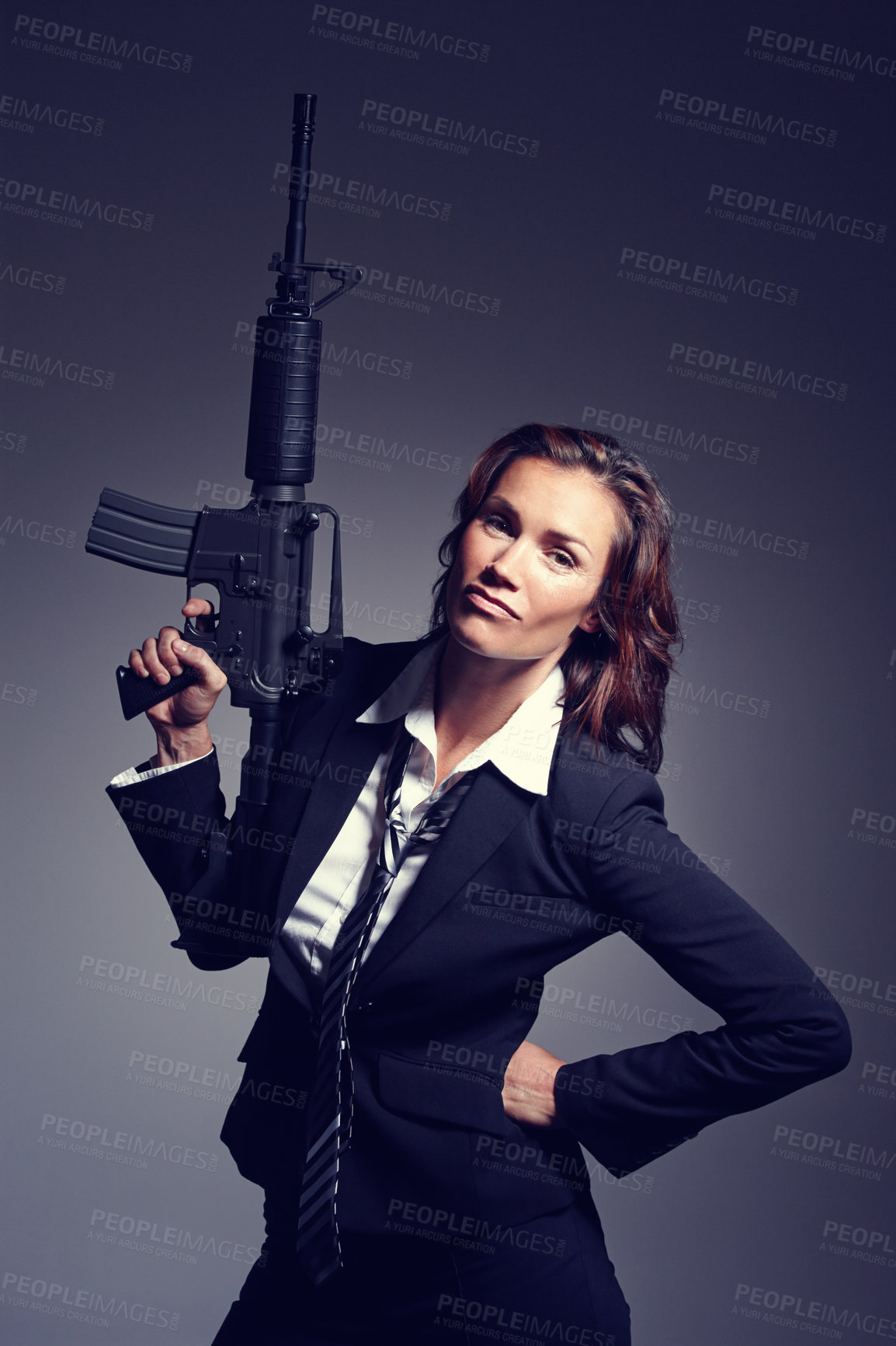 Buy stock photo Business woman, portrait and gun in suit on studio background for company threat, independence and danger. Female person, weapon or rifle as corporate criminal for crime, corruption or fraud