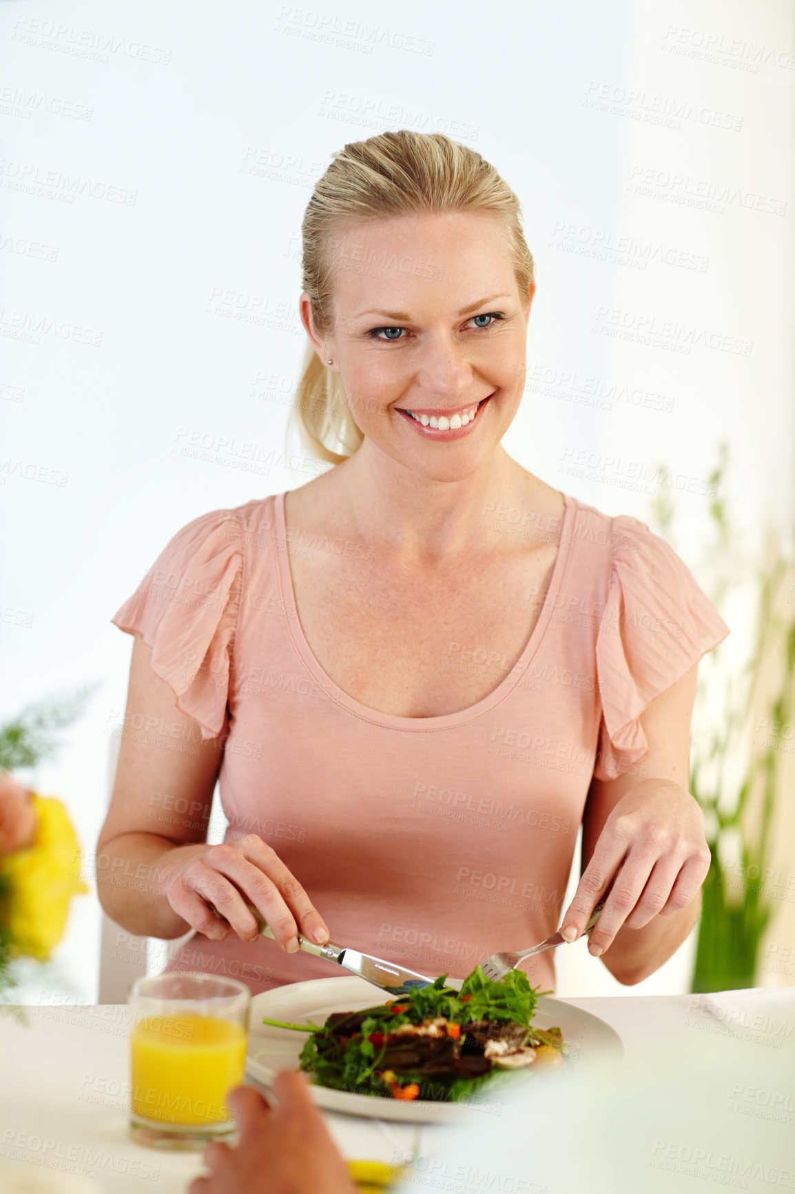 Buy stock photo Date, lunch and woman in home with food for romance, love and happiness with partner in living room. Couple, dinner and smile together in house with salad, chat and glass of juice in restaurant 