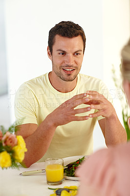 Buy stock photo A handsome man enjoying a healthy lunch with his wife