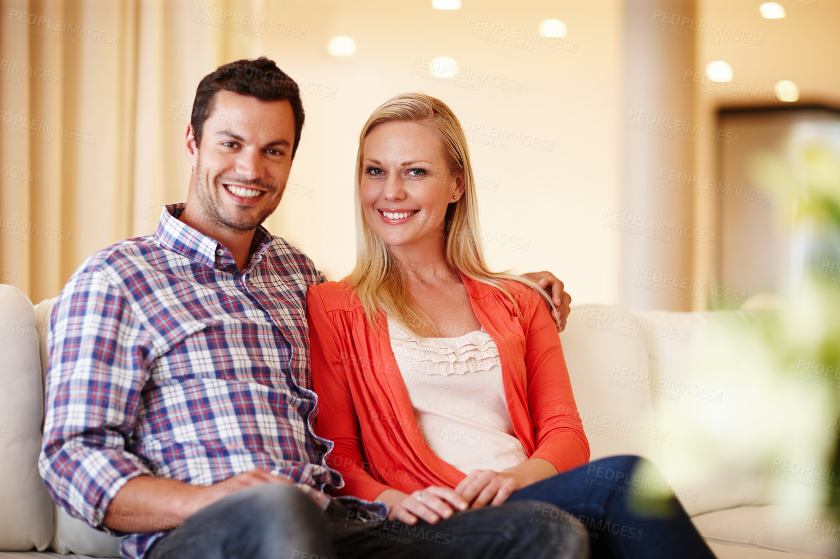 Buy stock photo Happy couple, hug and portrait in lounge for comfort, love and support for care in relationship. People, living room and embrace for security in marriage, bonding and happiness in connection in home