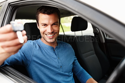 Buy stock photo Smiling male sitting in his car holding up his car keys