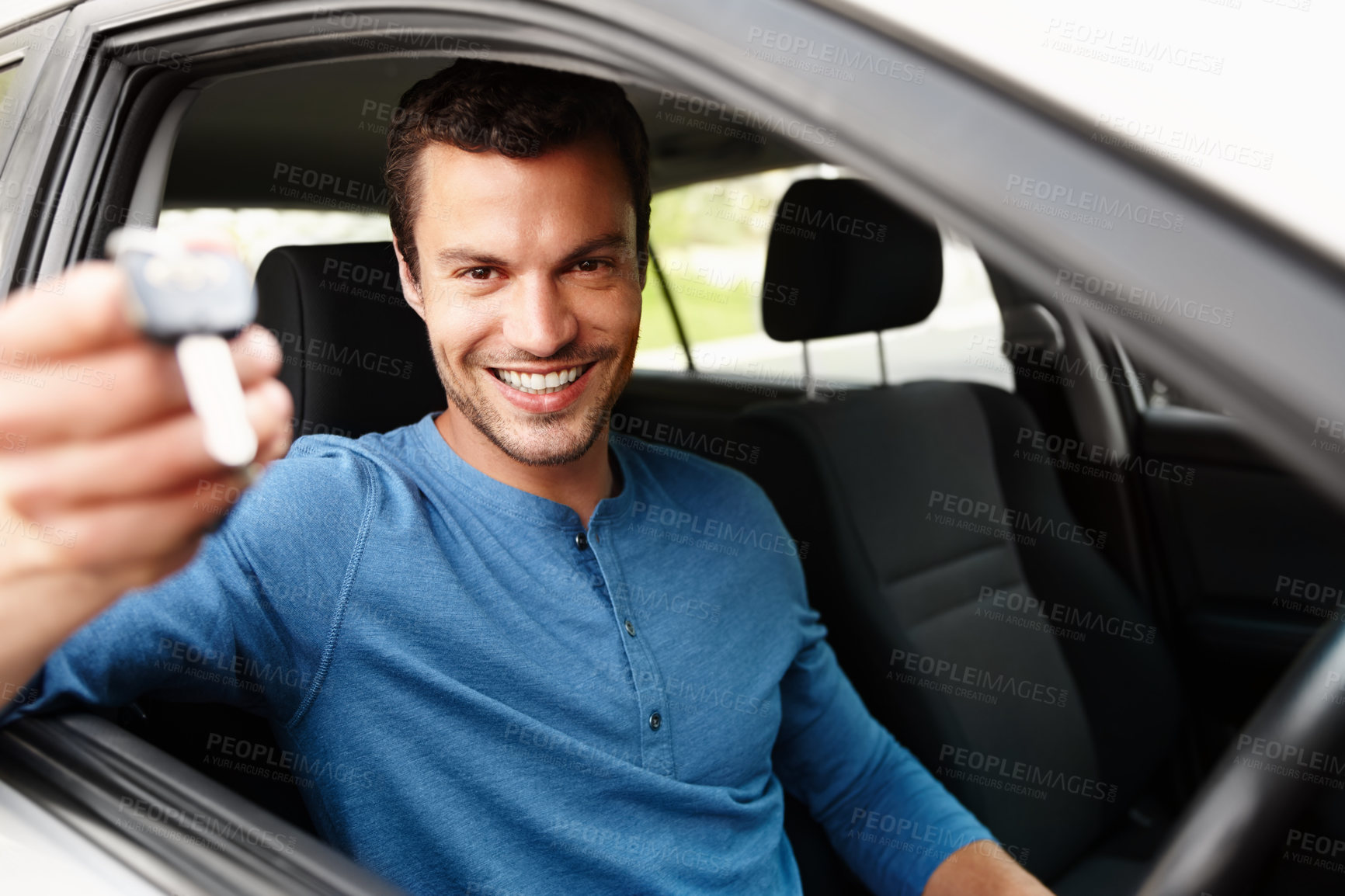 Buy stock photo Smiling male sitting in his car holding up his car keys