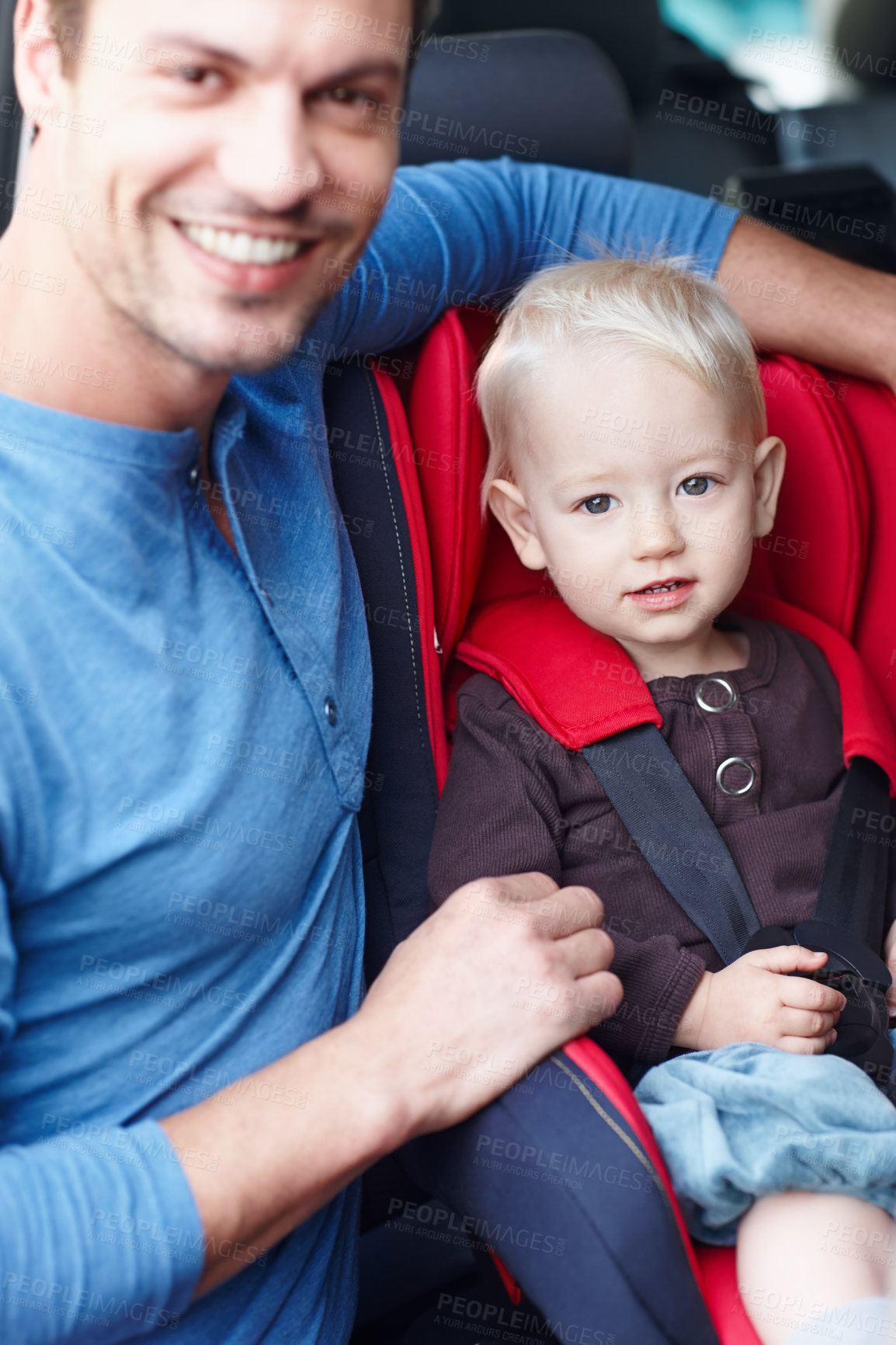 Buy stock photo Smile, father and portrait of baby in car seat for travel safety and protection in vehicle. Happy, parenting and dad with buckle for boy toddler in booster chair for driving on road trip in London.