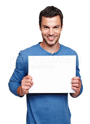 Buy stock photo Man, blank sign and portrait of a model with advertisement, marketing and sales billboard. White background, isolated and empty board poster of a person in studio for advertising with a smile 