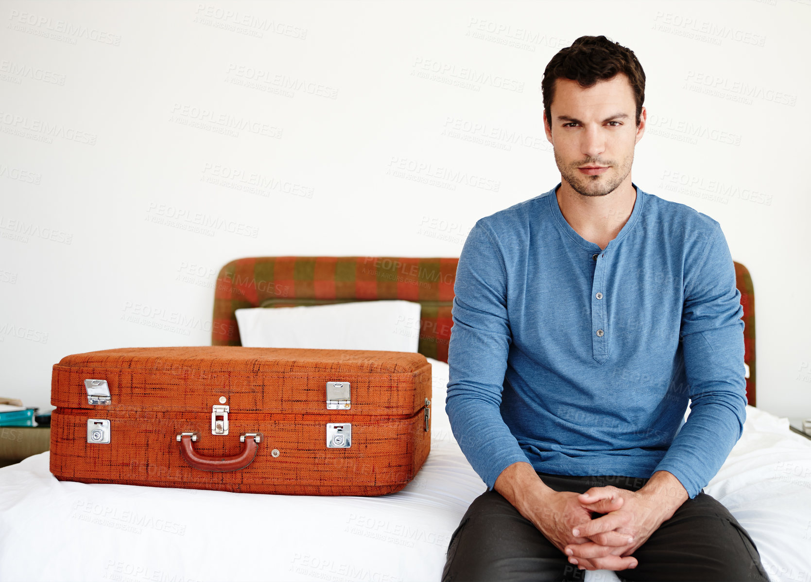 Buy stock photo Man, portrait and suitcase on bed in hotel for travel, vacation and summer as ready person in Spain . Tourist, face and luggage or bag in bedroom for journey, holiday and weekend  with preparation