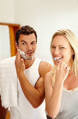 Buy stock photo Shaving, brushing teeth and couple in bathroom together with smile, dental hygiene and getting ready. Mirror, happy woman and man with toothbrush, foam for grooming and morning routine at home