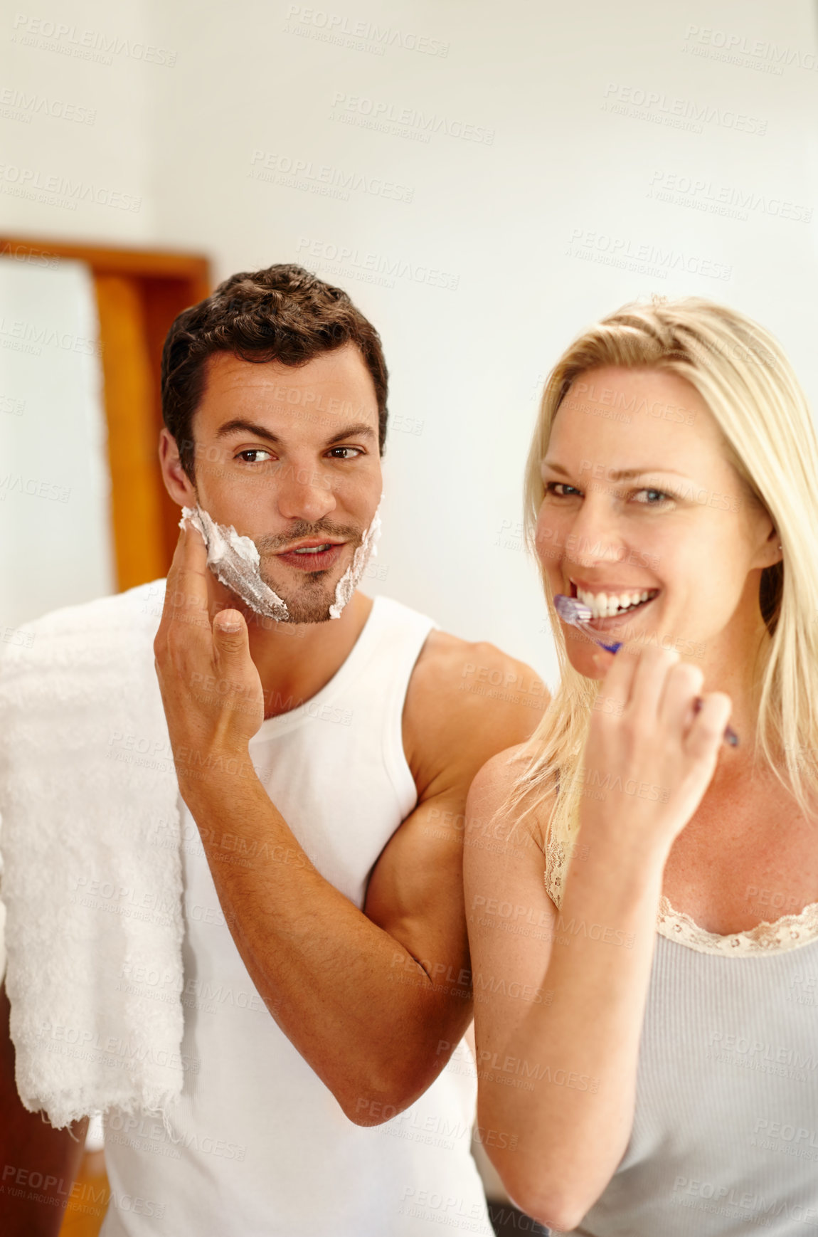 Buy stock photo Shaving, brushing teeth and couple in bathroom together with smile, dental hygiene and getting ready. Mirror, happy woman and man with toothbrush, foam for grooming and morning routine at home