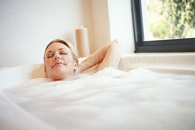 Buy stock photo A happy young woman relaxing in a luxurious foam bath