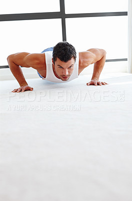 Buy stock photo A handsome man doing push-ups - copyspace