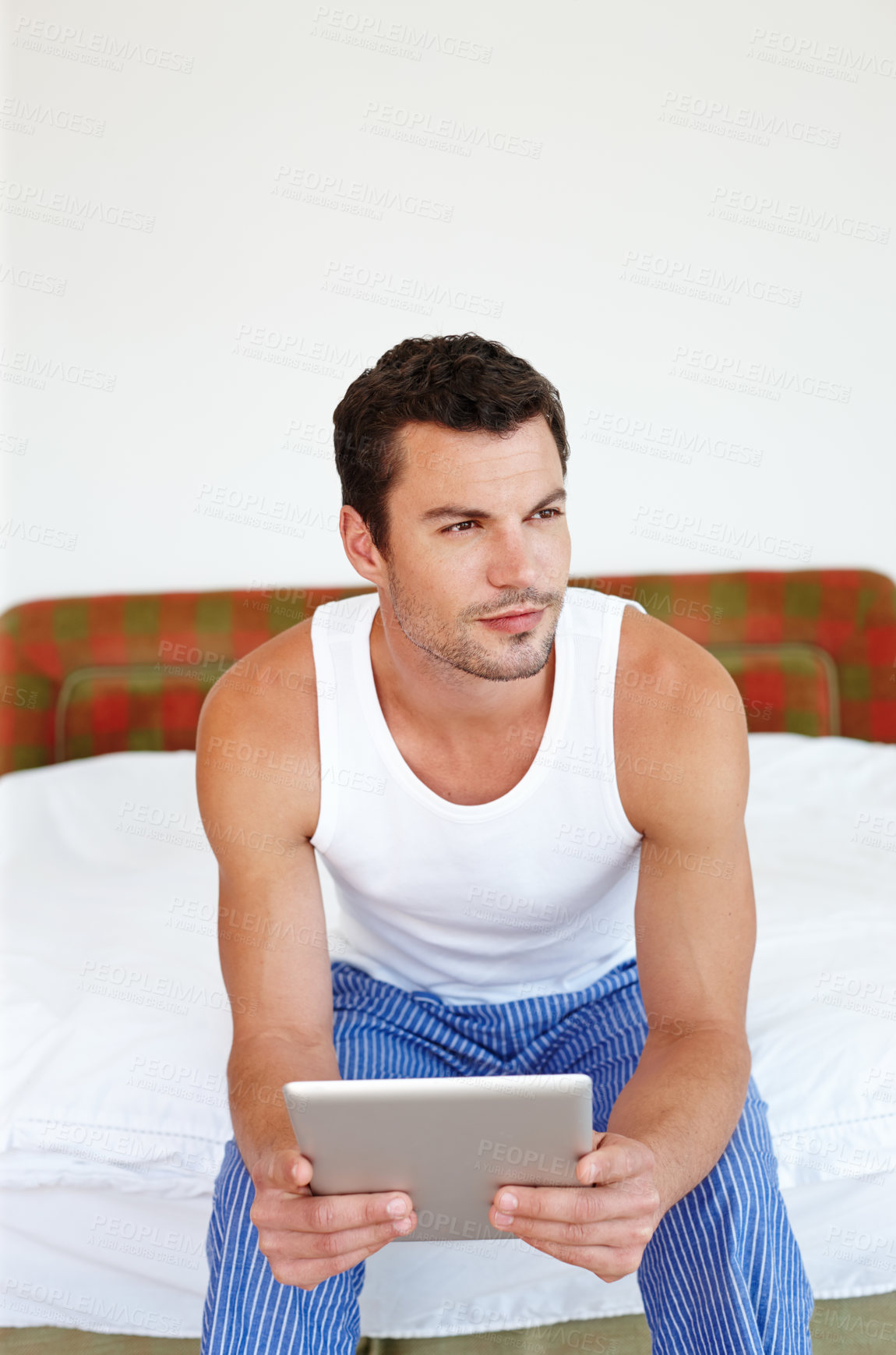 Buy stock photo Relax, tablet and man on bed in home for social media, online streaming and internet in bedroom. Thinking, morning and person on digital tech for reading website, news and communication on weekend