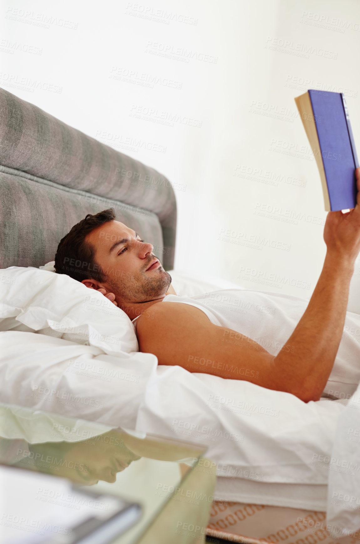 Buy stock photo Man, book and reading in bed for relax, fantasy and knowledge in morning or weekend. Male journalist, comfortable and cozy with literature and fiction for creativity and research for novel in home