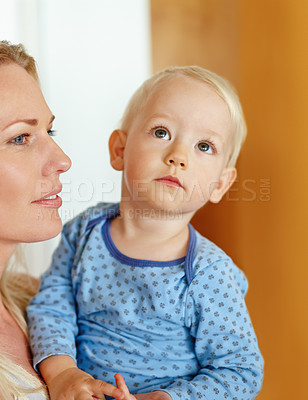 Buy stock photo A beautiful young mother holding her baby boy