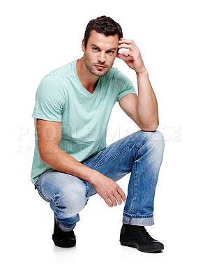 Buy stock photo Fashion, attitude and portrait of man on a white background in trendy, casual and stylish clothes. Confidence, handsome and isolated male fashion model kneel in studio in urban, retro and 2000s style