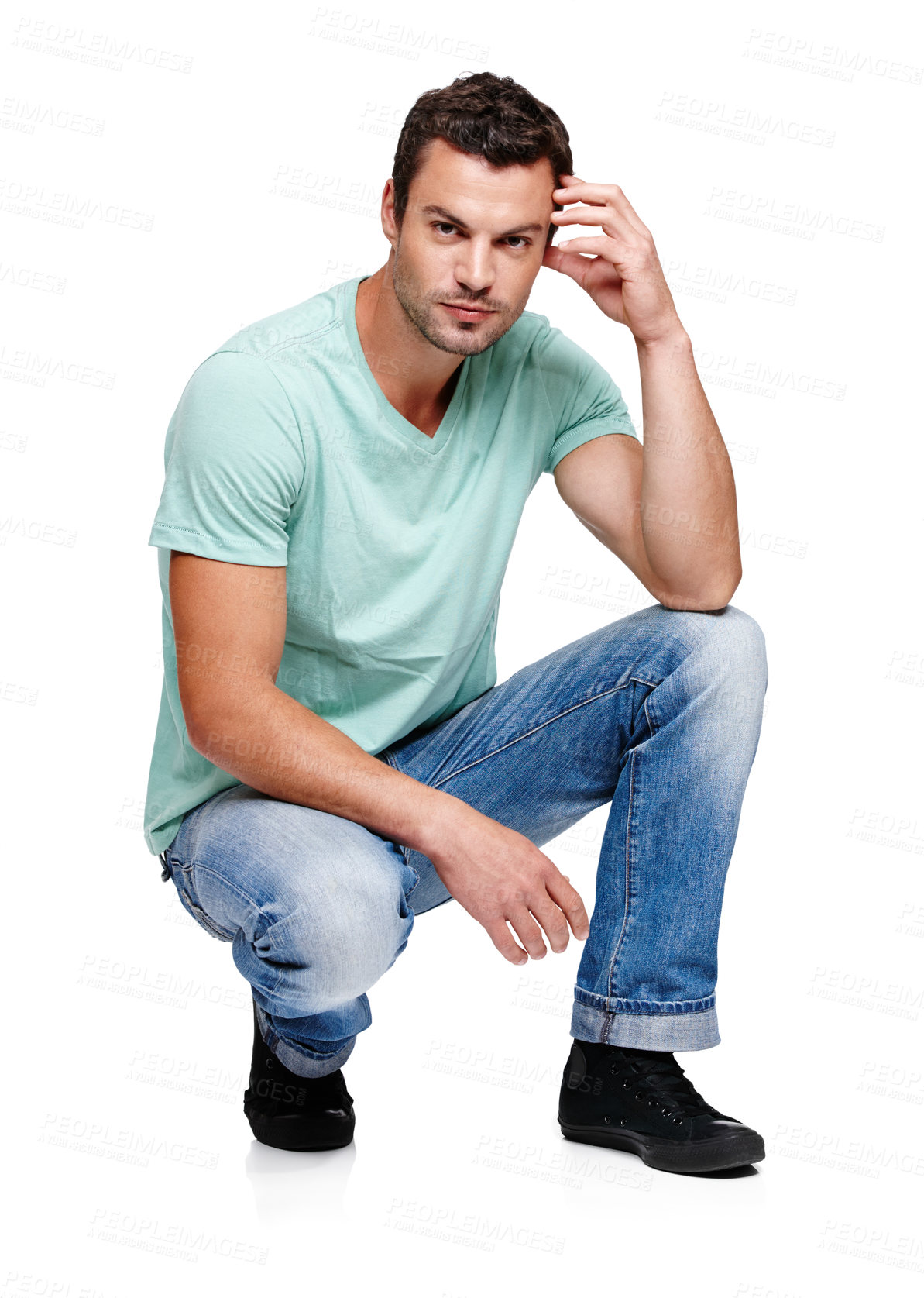 Buy stock photo Fashion, attitude and portrait of man on a white background in trendy, casual and stylish clothes. Confidence, handsome and isolated male fashion model kneel in studio in urban, retro and 2000s style