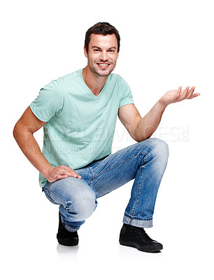 Buy stock photo Portrait, space and hand gesture with a man in studio isolated on a white background for marketing or advertising. Product, branding and mock up with a handsome young male posing to promote a brand