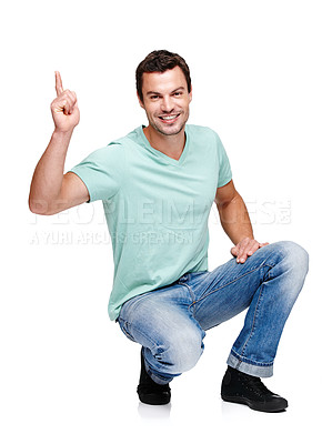 Buy stock photo Portrait, mock up and pointing with a man in studio isolated on a white background for marketing or advertising. Product, branding and mockup with a handsome young male posing to promote a brand