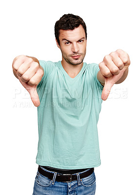 Buy stock photo Thumbs down, man and studio portrait, white background and isolated for wrong sign, poor review or body language. Disappointed guy, hands and bad opinion, rejection emoji and hate feedback of failure