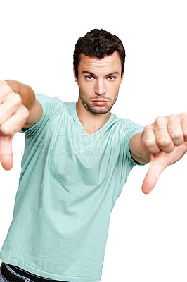 Buy stock photo Man, hands and thumbs down standing in disappointment for fail, wrong or disagree against white studio background. Portrait of isolated young male casual model pointing thumb down on white background
