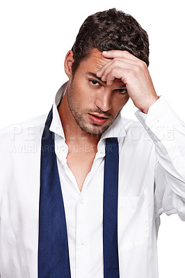 Buy stock photo A hungover young man wearing a dishevelled shirt and loose tie isolated on white