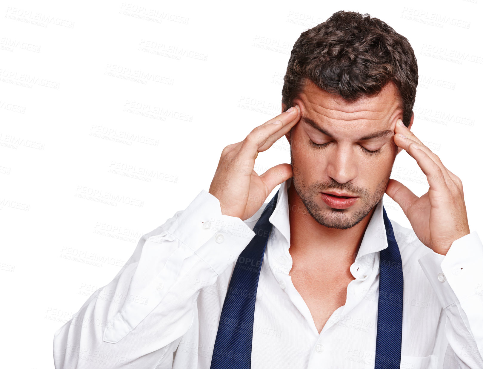 Buy stock photo A young man suffering from a rooting headache while isolated on white