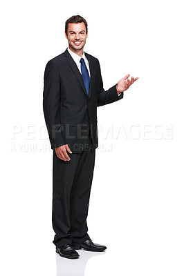 Buy stock photo Full length of a young businessman gesturing towards something while isolated on white