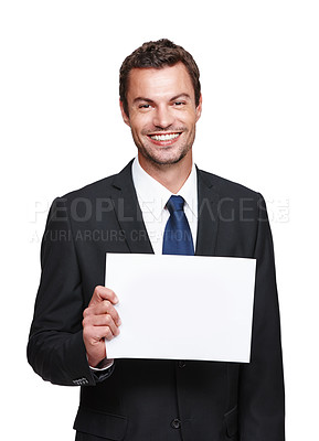 Buy stock photo A handsome young businessman holding a placard while isolated on a white background