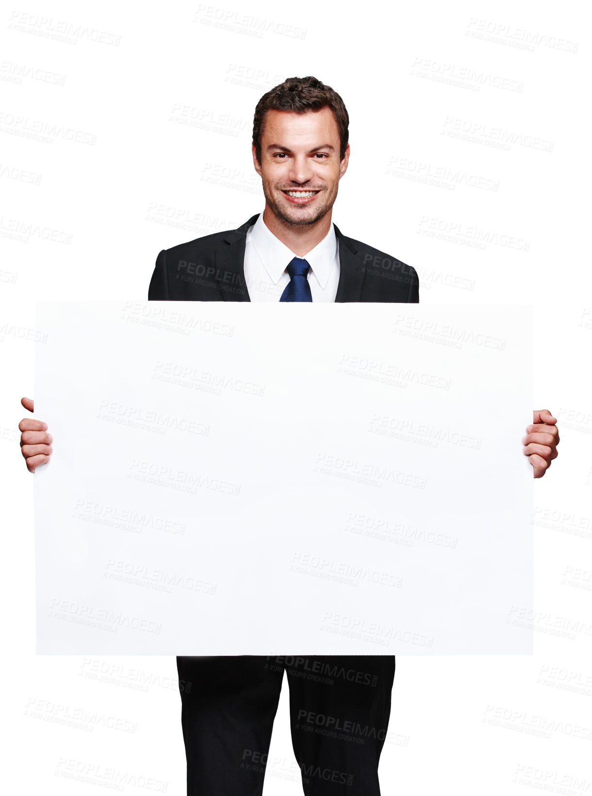 Buy stock photo A handsome young businessman holding a blank board while isolated on white