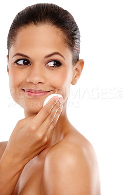 Buy stock photo Cropped view of a young woman using a cotton pad on her skin