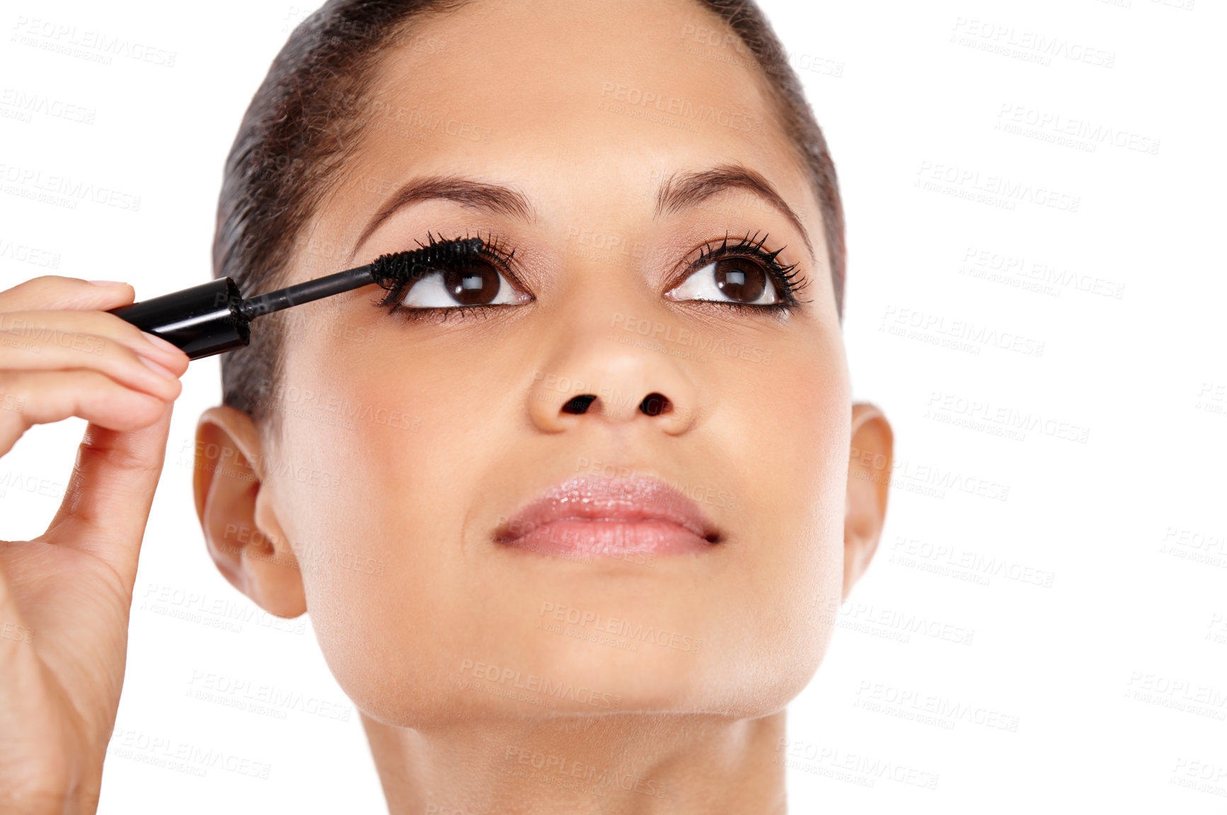 Buy stock photo Attractive young woman applying mascara to her eyelashes