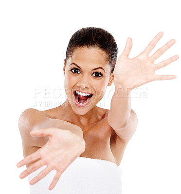 Buy stock photo A gorgeous young woman laughing while gesturing with her arms outstretched