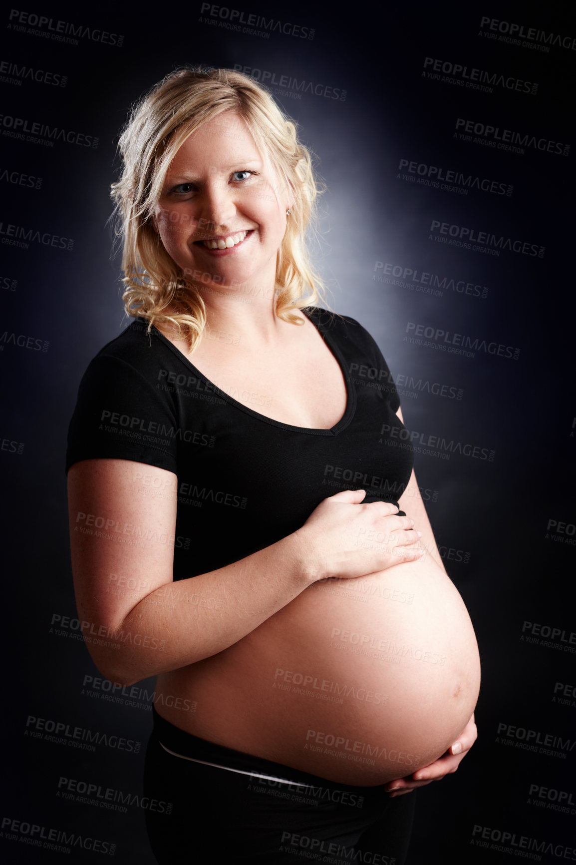 Buy stock photo Pregnant, woman and portrait with stomach in studio, baby bump and expectant mother for pregnancy. Black background, gestation and gynecology or family planning, maternity and love for unborn kid