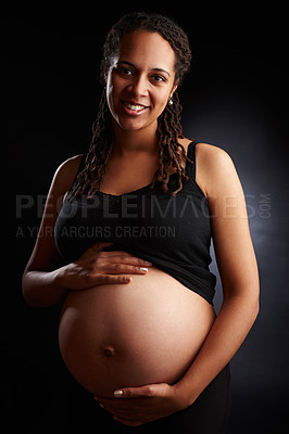 Buy stock photo Pregnant, mom and portrait with belly in studio, baby bump and expectant woman for pregnancy. Black background, gestation and gynecology wellness or family planning, maternity and stomach growth