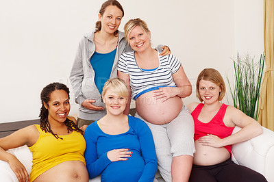 Buy stock photo Pregnancy, woman and friends on couch for relax, group and unity for support in lounge. Sofa, stomach and diversity for growth of children, portrait and together with mom people for maternity class