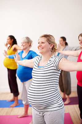 Buy stock photo Pregnant, woman and yoga class with friends, stretch and  pregnancy pilates. Smile, fitness and group for flexibility and happy people, exercise or maternity workout for health or support together