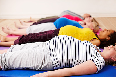 Buy stock photo Meditation, woman and pregnant on floor for relax, group and class for zen in studio. Yoga, holistic or pregnancy pilates or community with female people, spiritual or mindfulness for health together