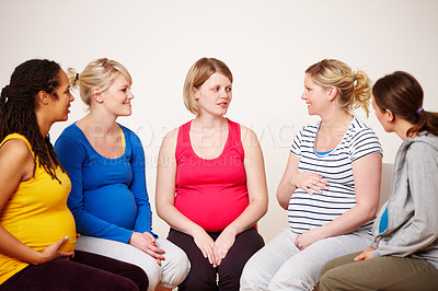 Buy stock photo A group of pregnant women sitting down together to share their feelings