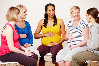 Buy stock photo A group of pregnant women sitting down together to share their feelings