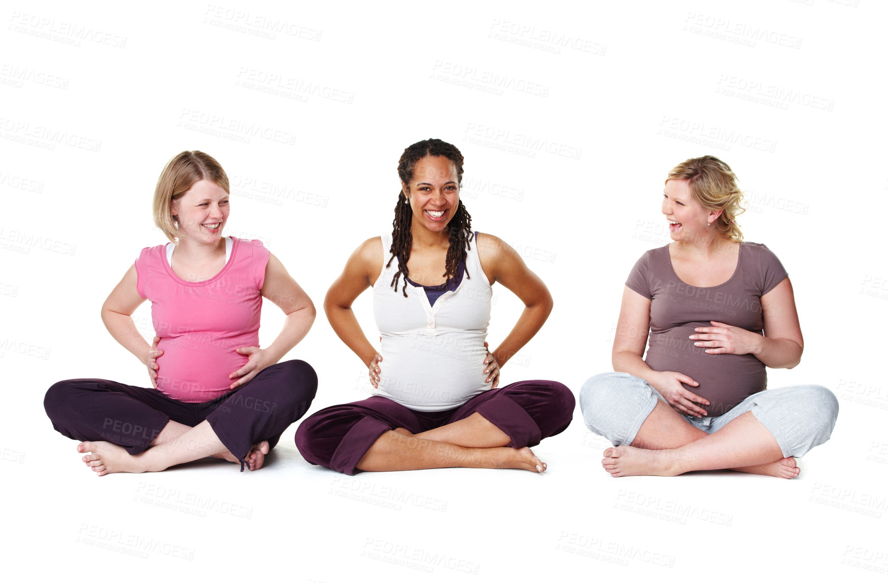 Buy stock photo Pregnant friends sitting against a studio white background, enjoying getting healthy and prenatal care together. Diverse mothers in a birth class, bonding and learning relax and stress relief tips